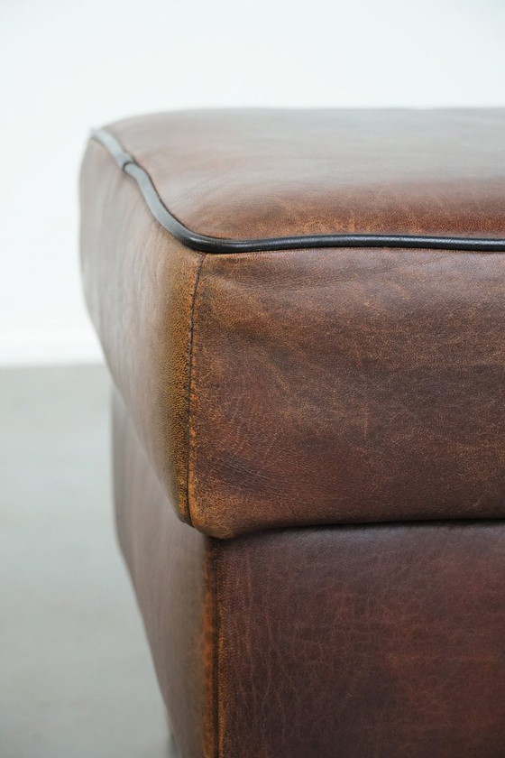 Image 1 of Vintage sheepskin stool with black piping