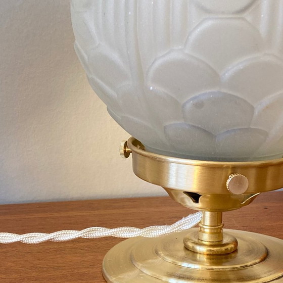 Image 1 of Pair of vintage bedside lamps with antique glass globes and brass bases, circa 1950