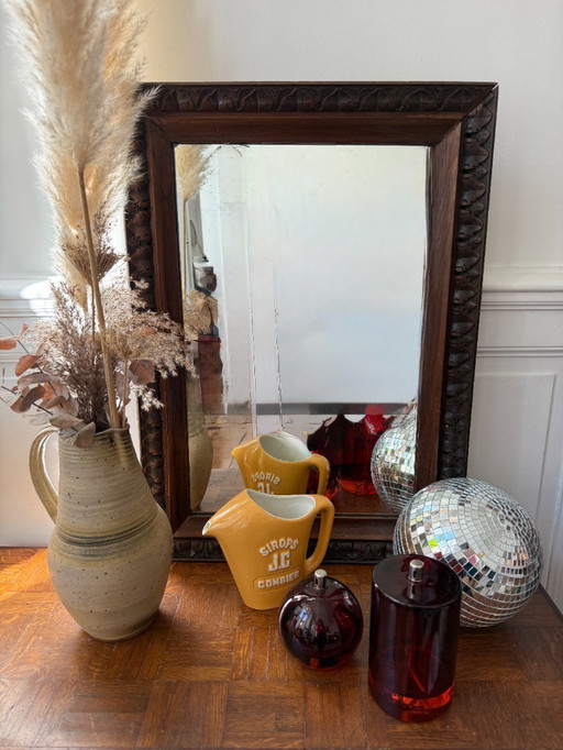 Specchio antico in legno intagliato