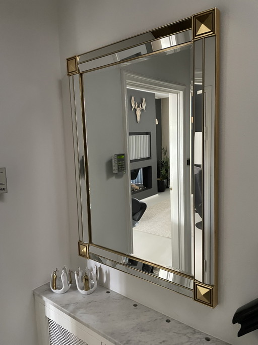 Gold mirror with beveled edge and corner accents