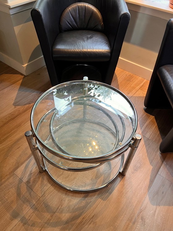 Unique vintage Italian coffee table with chrome frame and four round glass tops. Three outer tops can be (photo 9 of 10)