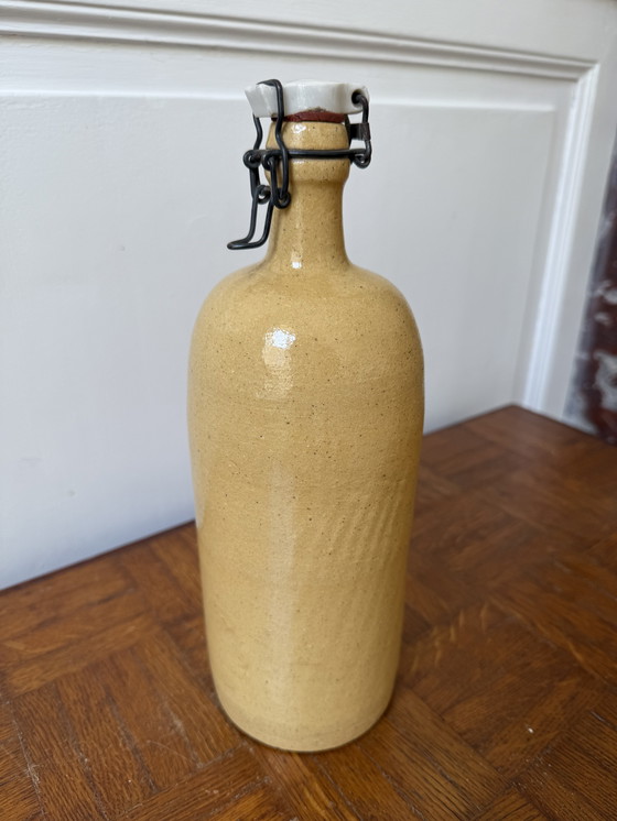 Image 1 of Bouteille vintage en grès jaune 