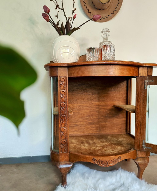 Vitrinekastje vroeg Art Deco met rond glas