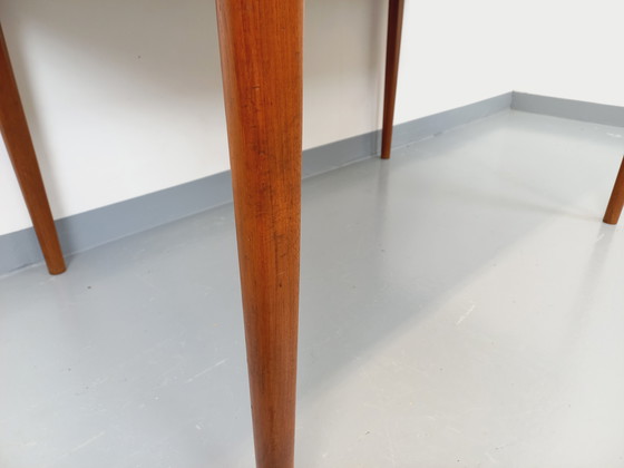 Image 1 of Scandinavian rectangular vintage dining table by Johannes Andersen for Samcom from the 60s in teak with integrated extensions