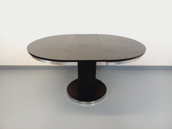 Image 1 of Table ronde de repas vintage en mélaminé esprit bois noir et métal chromé style Space Age / Diner des années 70 avec rallonge in