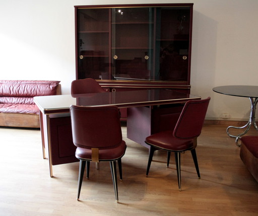 Umberto Mascagni study set, desk with three chairs and bookcase, in burgundy imitation leather and brass, 1950 Italy