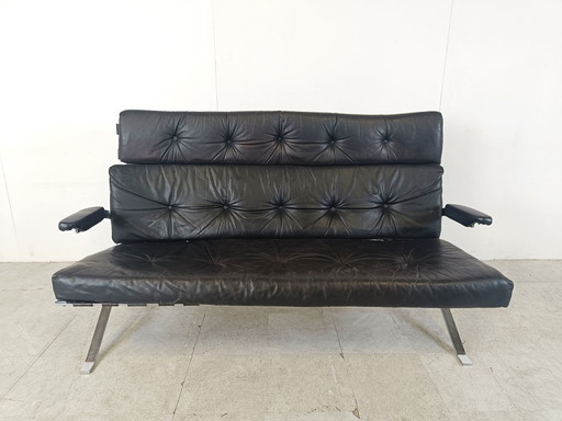 Divano vintage in pelle nera e cromo