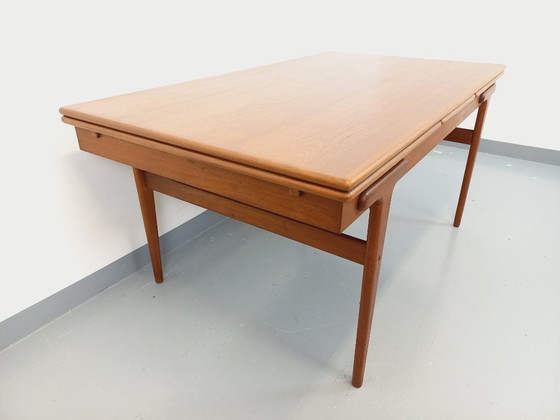 Image 1 of Vintage Scandinavian rectangular dining table by Ejvind A. Johansson from the 50s and 60s in teak with integrated extensions