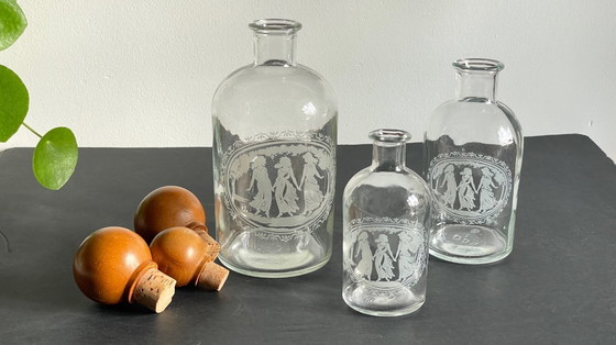 Image 1 of Vintage Engraved Glass and Wood Bottles