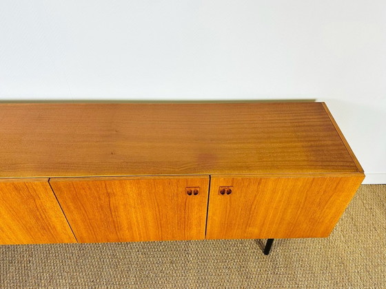 Image 1 of Minimalist Scandinavian sideboard in teak with black metal legs, 1960