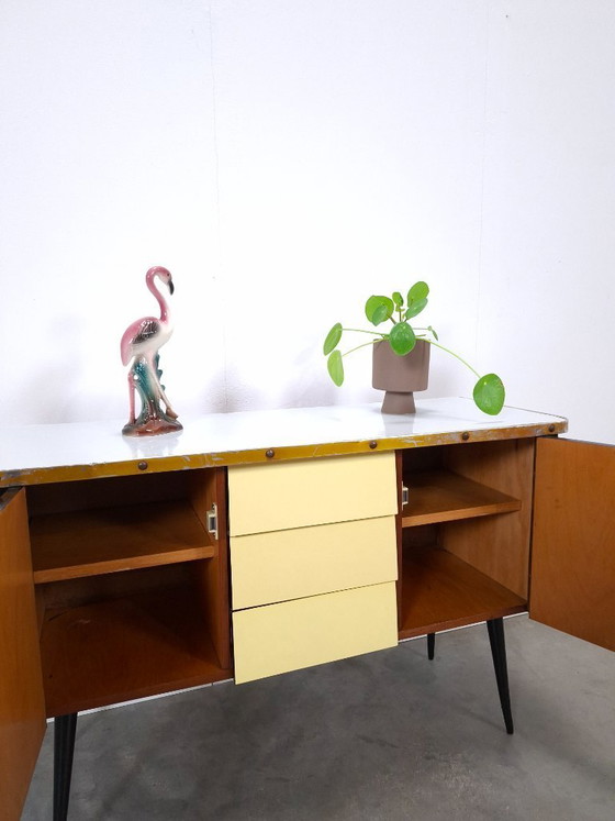 Image 1 of 1950s light blue-yellow cabinet with Formica and slanted legs