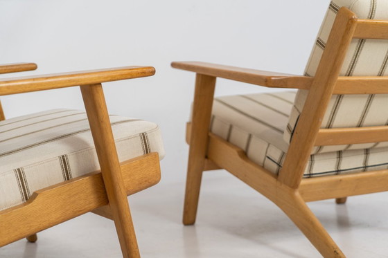 Image 1 of Pair of Early GE-290 lounge chairs in oak by Hans J. Wegner for Getama (Denmark, 1953).