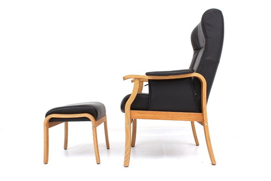 Image 1 of as new, Danish Nordic Easy Lounge Chair / Relax Armchair with stool in oak and leather.