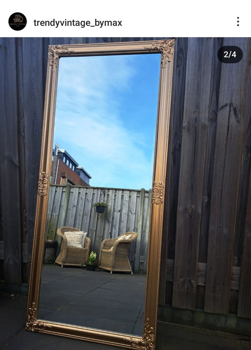 Gran espejo de bronce dorado con facetas