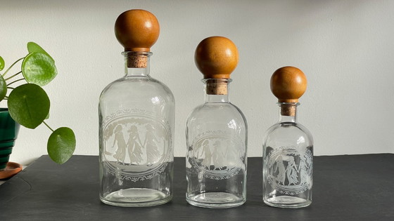 Image 1 of Vintage Engraved Glass and Wood Bottles