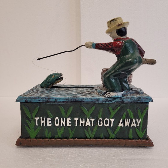 Image 1 of "Fisherman" piggy bank with fishing mechanism, cast iron, 1950s - USA.