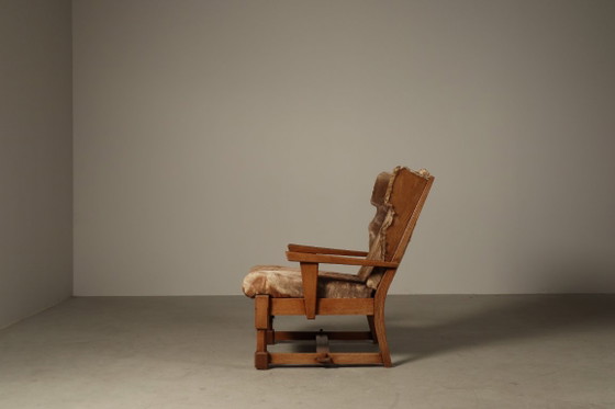 Brutalist oak lounge armchair and ottoman in original goat hide, 1960s – Wood (photo 9 of 15)