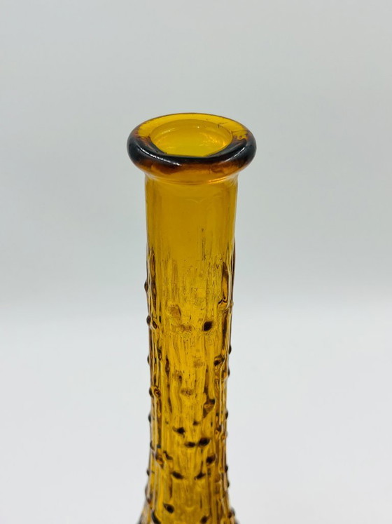 Image 1 of Set van twee vintage Empoli-flessen van getextureerd amberkleurig glas.