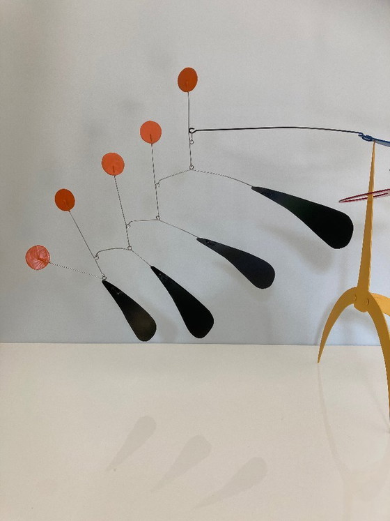 Image 1 of Yellow standing mobile with 5 orange discs