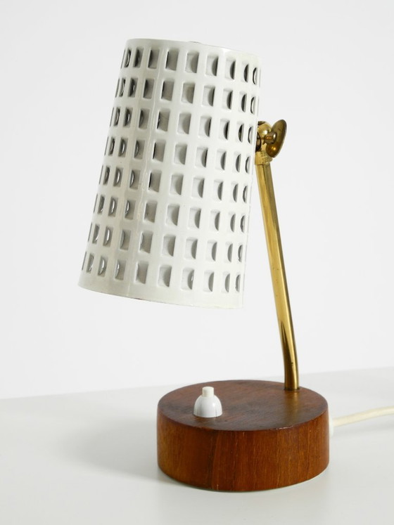 Image 1 of A pair of beautiful mid-century modern bedside lamps with perforated metal shades and teak wood bases