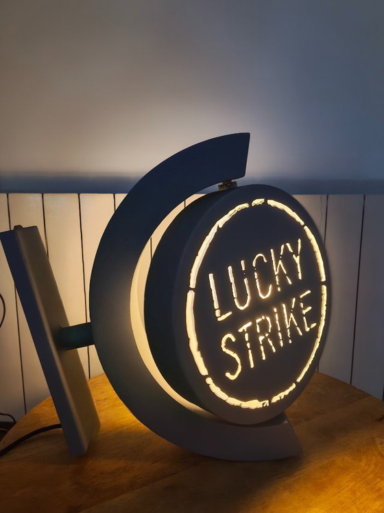 Image 1 of Vintage draaiend lichtreclamebord Lucky Strike
