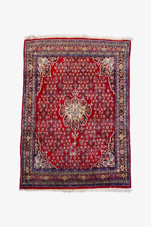 Tapis persan rouge vintage à motifs
