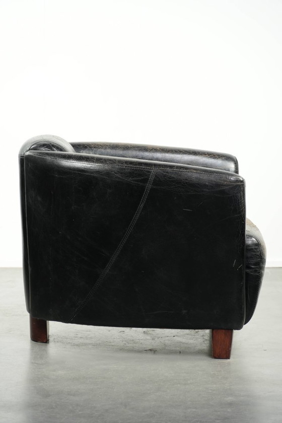 Image 1 of Zwarte vintage rundleren Aviator design fauteuil met een karaktervolle uitstraling