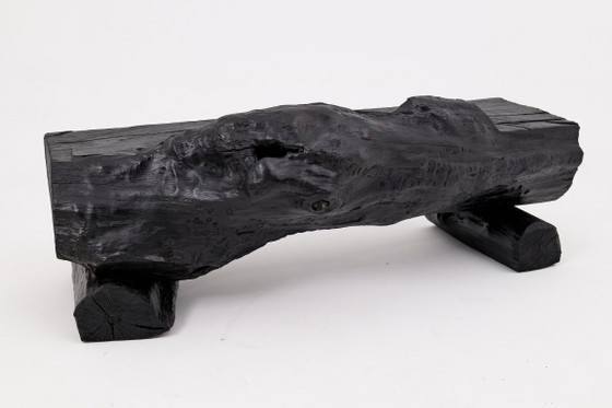 Image 1 of Bank van massief verkoold hout van Logniture – een organisch, modern en sculpturaal zitmeubel.