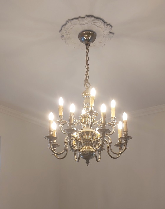Image 1 of beautiful lusters bronze with silver
patinated.
MOD DEP LAMP ART
12 arms and 8 arms.