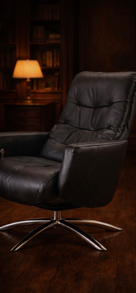 Image 1 of Modernist black leather armchair with a chrome X-frame base in a contemporary style, in good condition with minor signs of aging