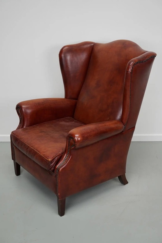 Image 1 of Vintage Nederlandse cognackleurige leren clubfauteuil met vleugelrug