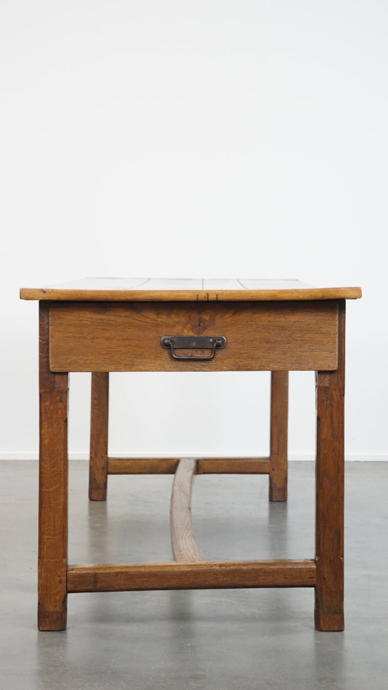 Image 1 of Large antique French farmhouse dining table made of fruitwood from the late 18th century with beautiful and original details.