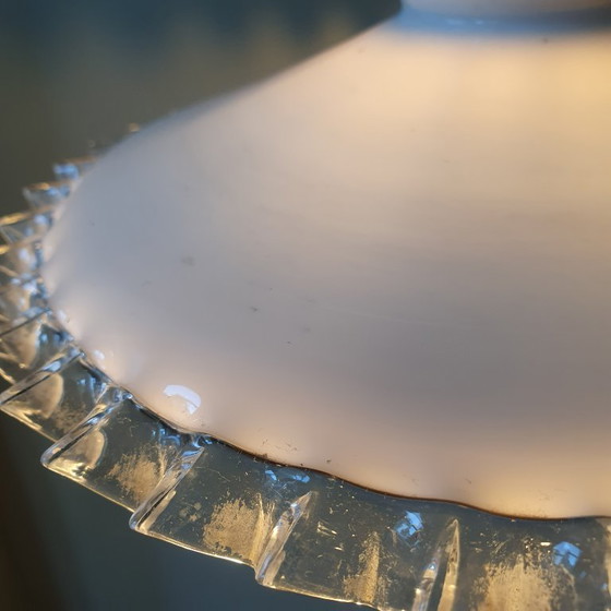 Image 1 of 2 vintage hanglampen van wit opaline glas met een transparante sierrand.