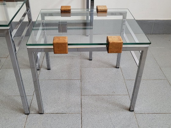 Image 1 of SET DI 3 TAVOLINI IMPILABILI SCANDINAVI VINTAGE ANNI '60 IN TEAK, ACCIAIO E VETRO ANNI '60