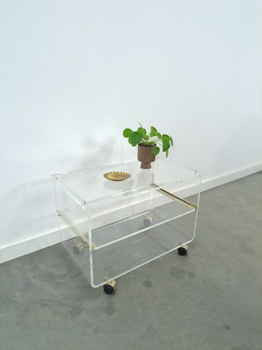 Space age plexiglass trolley with brass