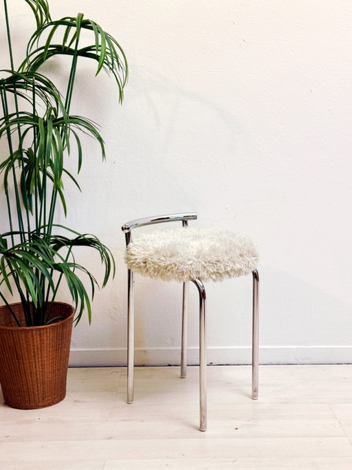 Vintage tubular frame stool with fluffy upholstery