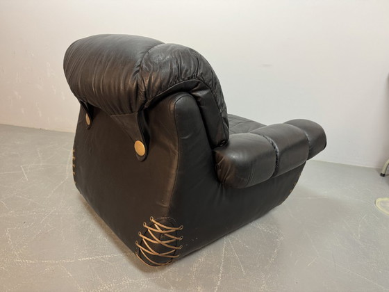 Image 1 of Beautiful Big Black Leather Postmodern Italian Design Space Age Lounge Chair with Brass Buttons and Playful Cord Lacing, 1970s.
