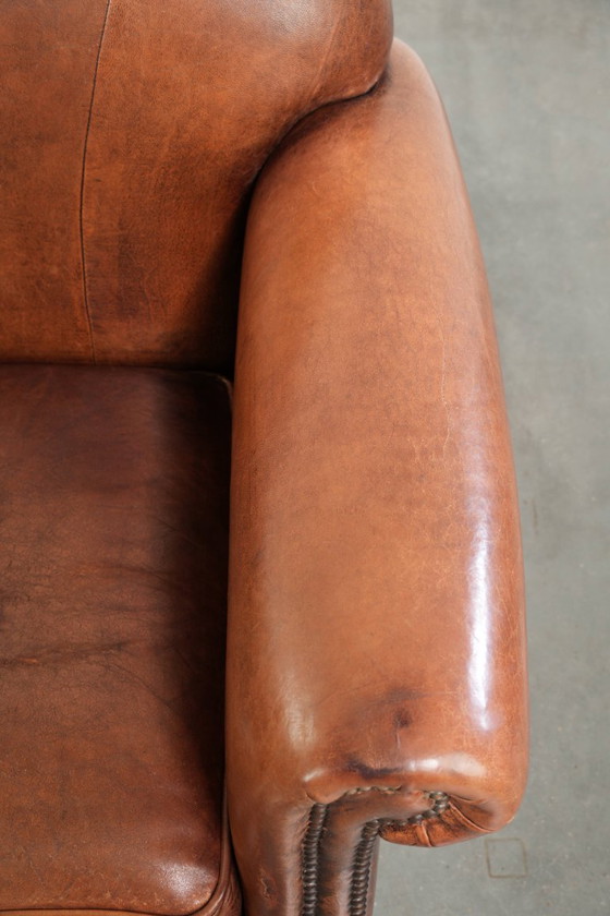 Comfortabele vintage schapenleren armchair afgewerkt met siernagels – Fauteuils, Leather, Klassiek (photo 8 of 12)