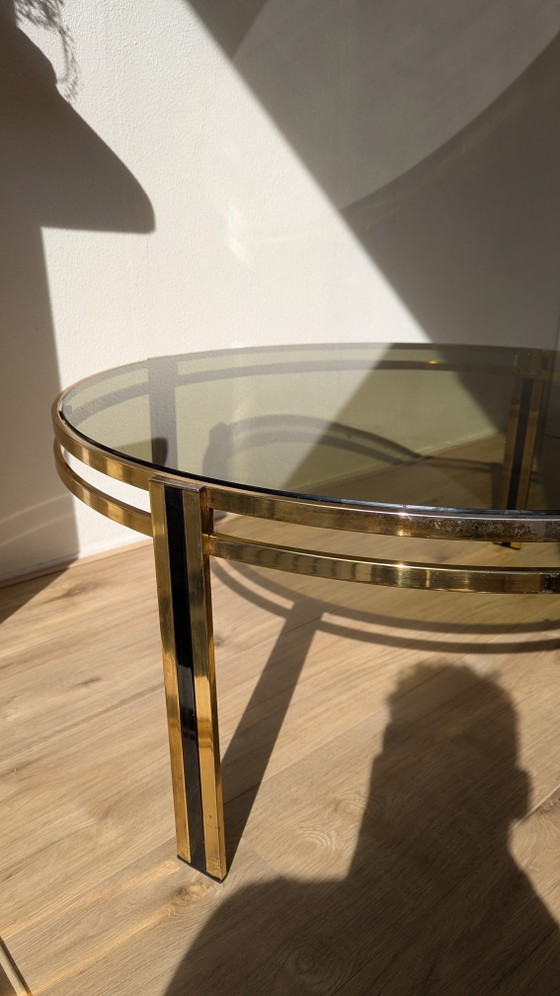 Image 1 of Hollywood Regency salontafel van zwart messing en gerookt glas