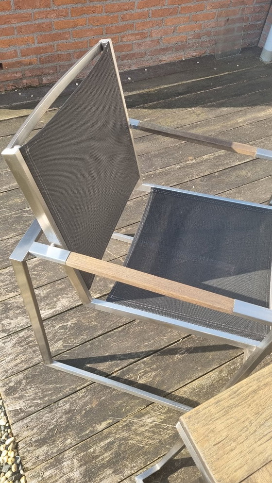 Image 1 of Set da giardino con tavolo in teak e 4 sedie in acciaio inox, realizzato in teak e textilene.