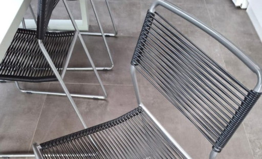 Designertisch + 6 Drahtstühle