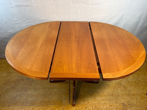 Image 1 of Mid-Century Retro Vintage Teak Extending Round Dining Table by Parker Knoll – 1970.    Elegant|Space-Saving|Practical|Iconic Bri