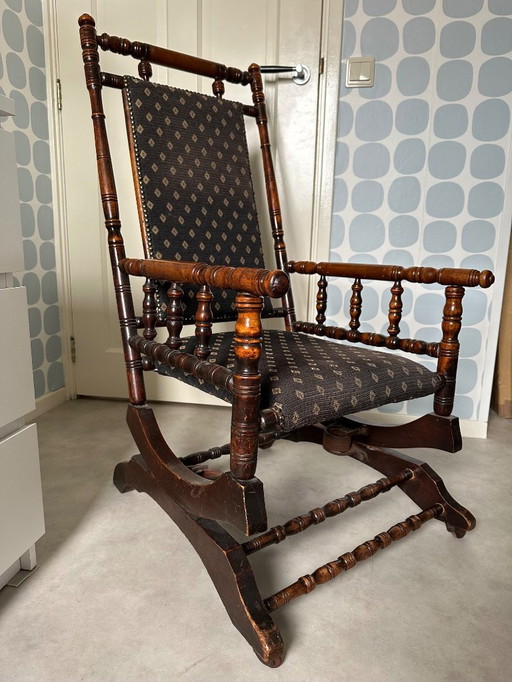 1 antique walnut rocking chair reupholstered about 10 years ago.