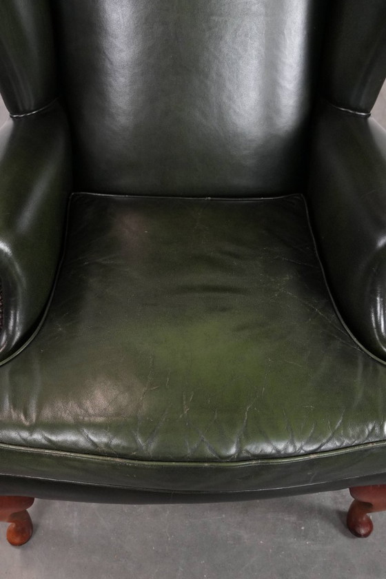 Image 1 of Fauteuil Chesterfield classique en cuir de vachette lisse de couleur vert foncé