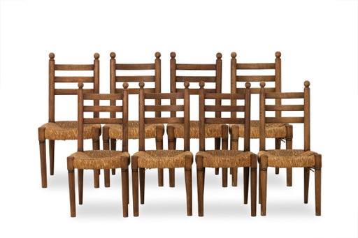 Set of 8 oak straw-seated chairs. 1950s.