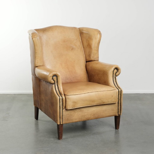 Lichte rundleren oorfauteuil met een goed zitcomfort