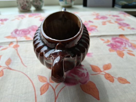 Image 1 of Cool brown cast iron vase.