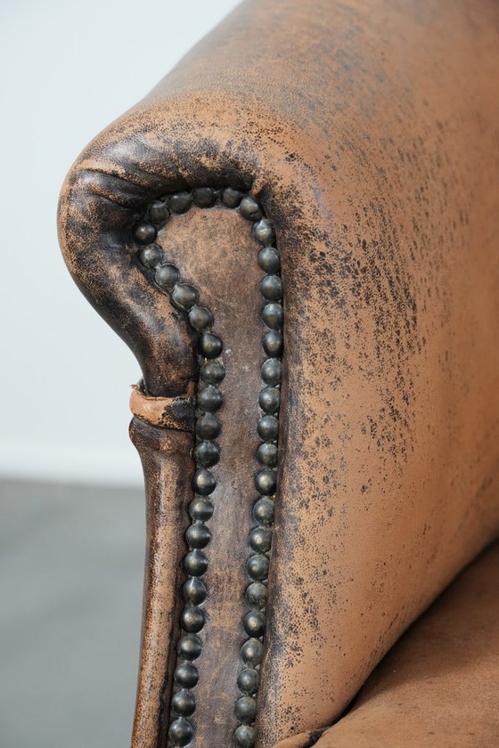 Image 1 of Timeless vintage sheepskin club armchair with character and a beautiful patina