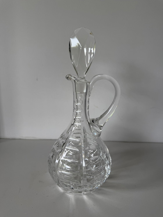 Image 1 of Karan en cristal rond avec main à