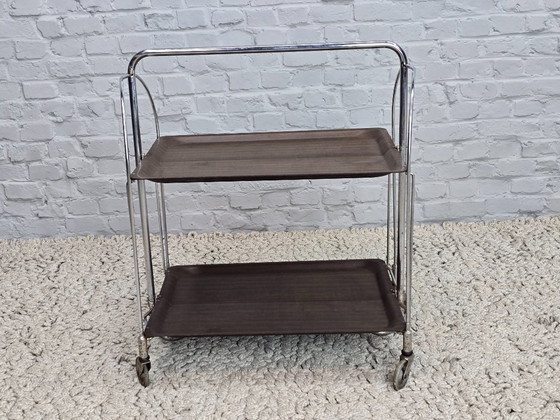 Image 1 of Vintage Foldable and Mobile Chrome Steel 2 Faux Wood Layers ‘Dinett’ Serving Trolley by Bremshey Gerlinol, Germany, 1970s. 